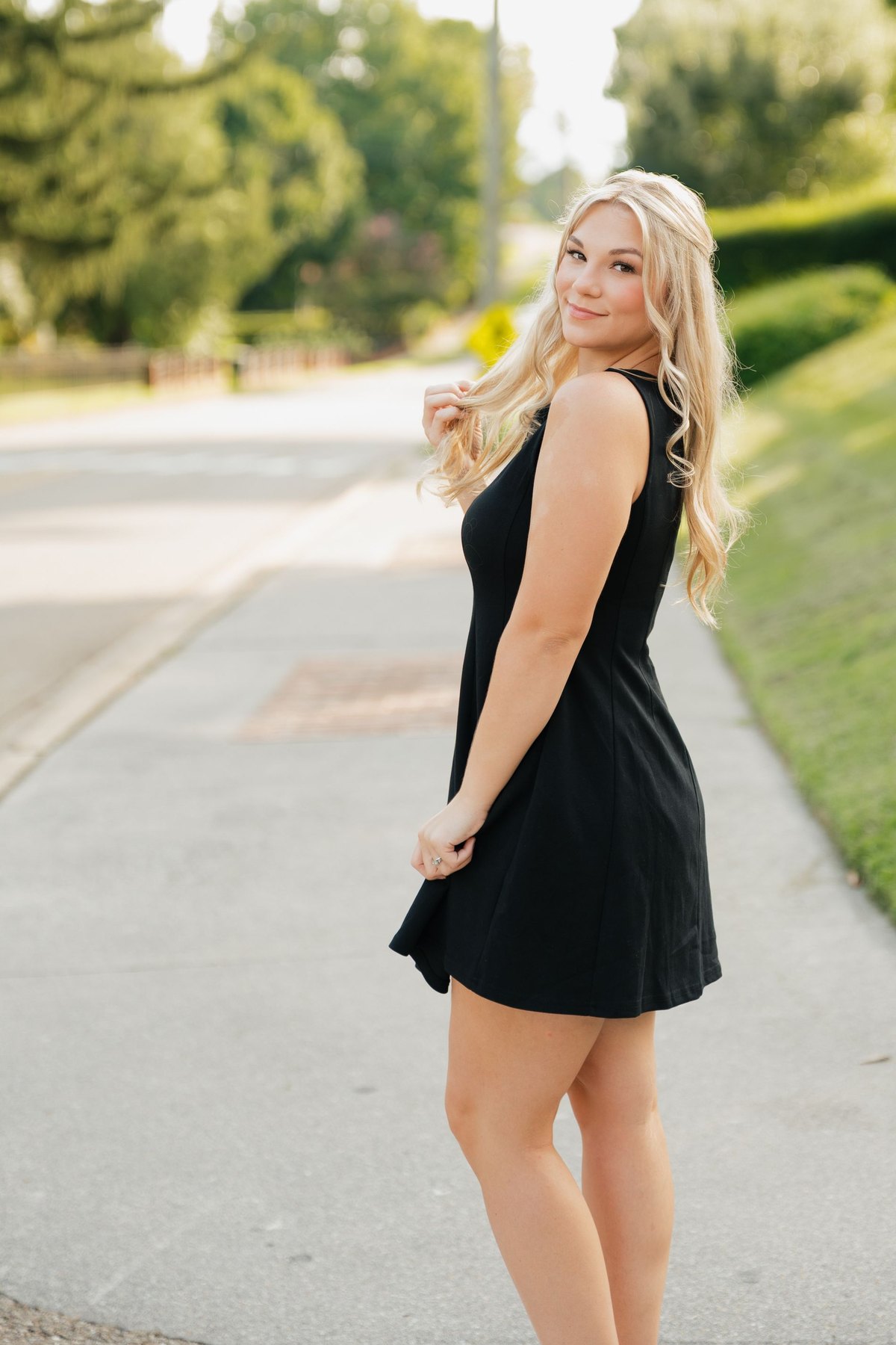 Kenady Skelton on a tree-lined sidewalk
